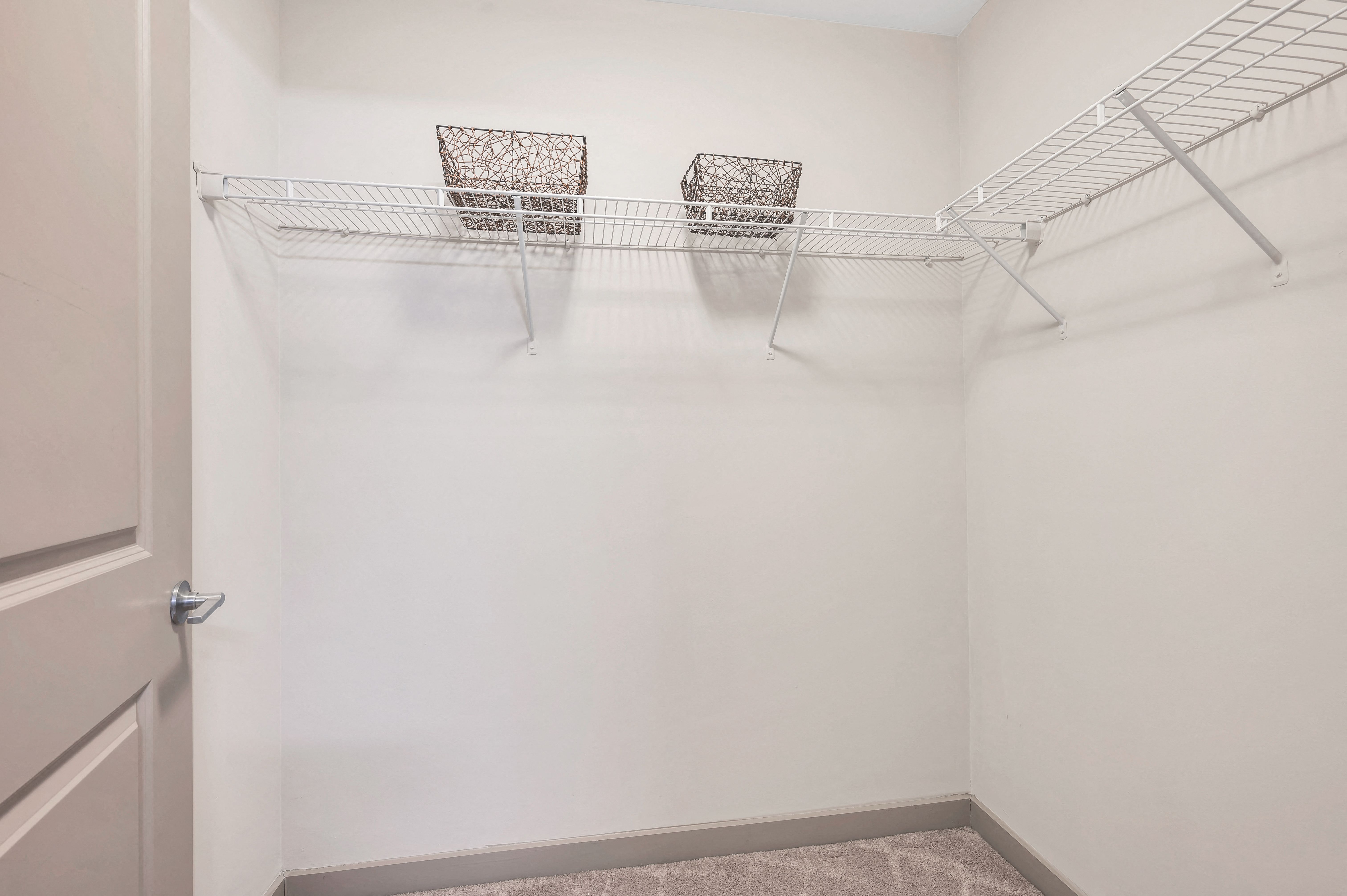 Oversized walk-in closets attached to master bedroom providing extra storage Oversized walk-in closets attached to master bedroom providing extra storage